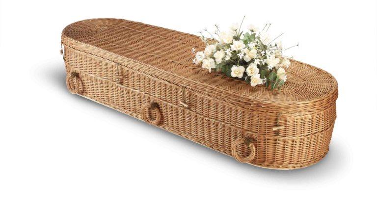 a wicker bio-degradable eco coffin isolated on white with clipping path
